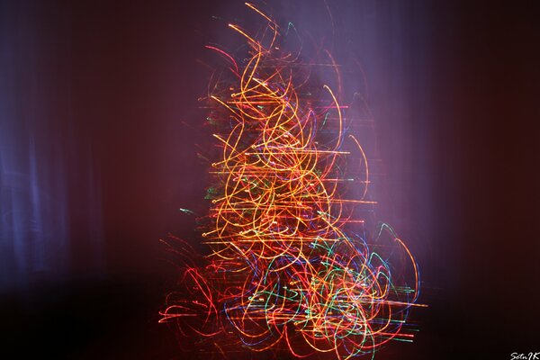 A Christmas tree created from light orange swirls