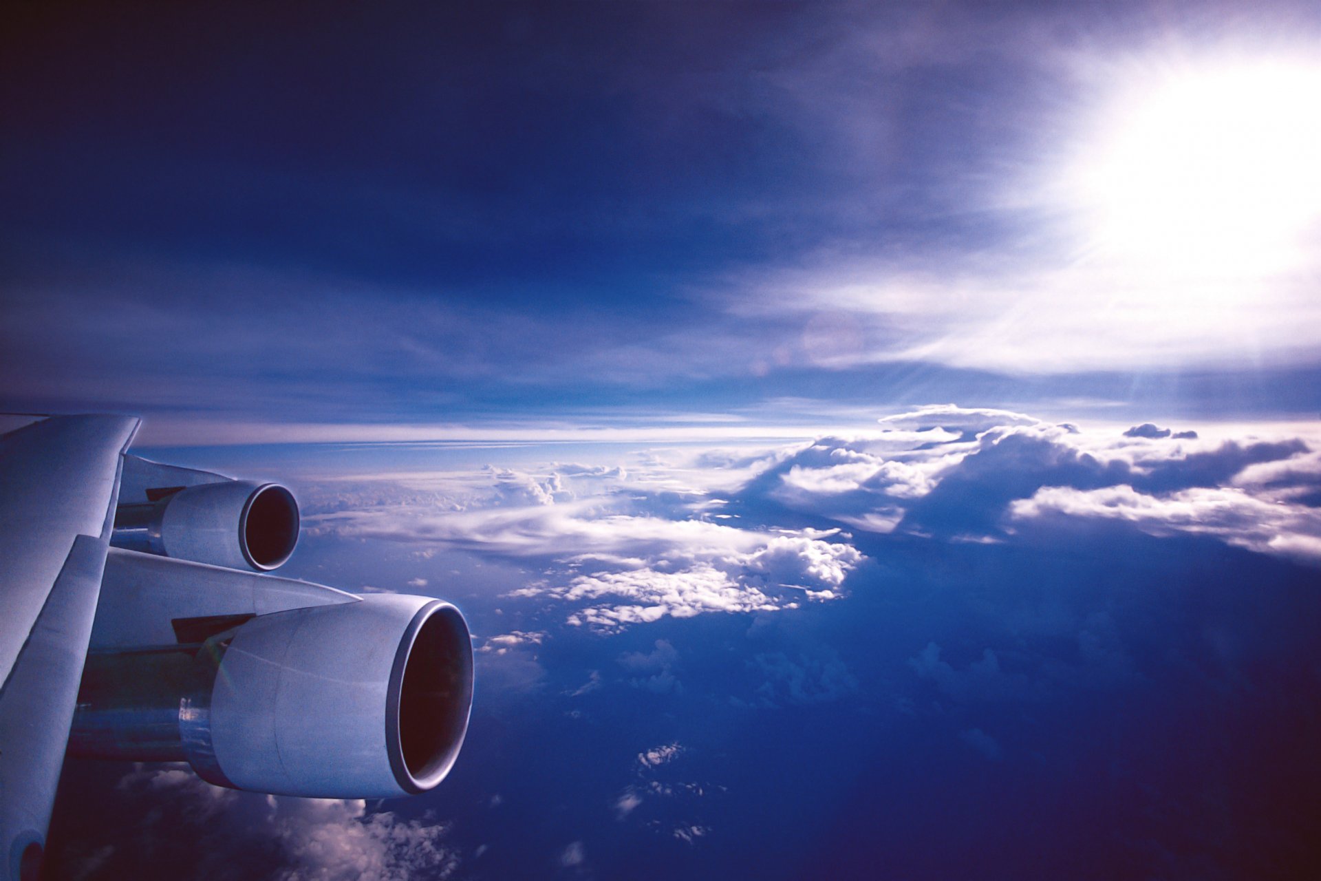 aviation wing engines in the air plane clouds sky sun highlight