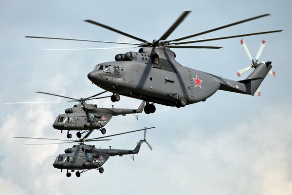 Military helicopters lined up in the sky