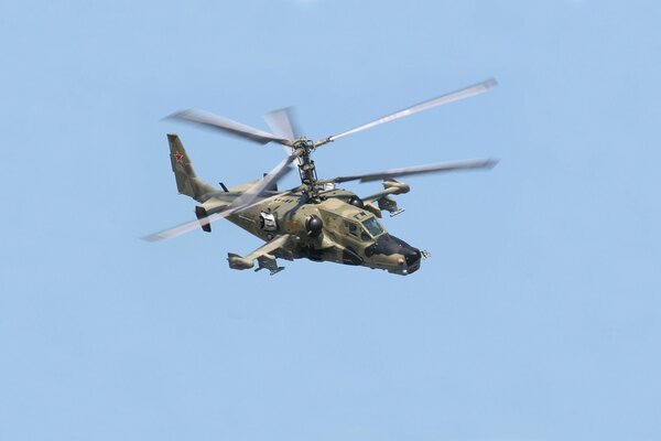 Military helicopter in flight photo