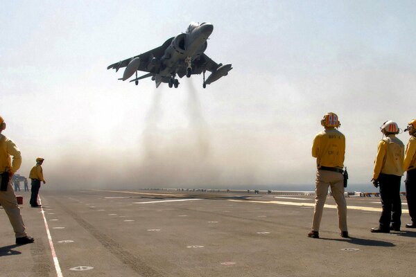 A huge aircraft carrier takes off into the sky