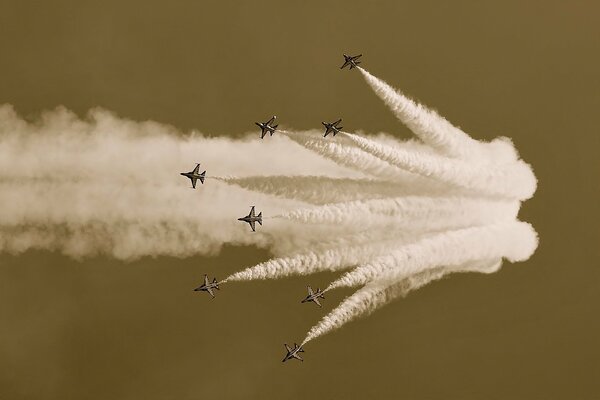 Airshow in the gray sky over the airfield