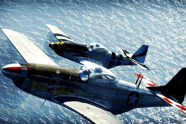 North American P-51 Mustangs are flying high in the sky