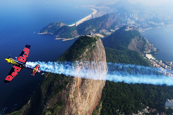 A sports cornhusker flies over the mountain most likely drops a supply of water from a tank