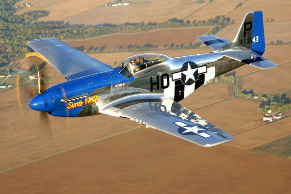 Military aircraft p-51 in the air