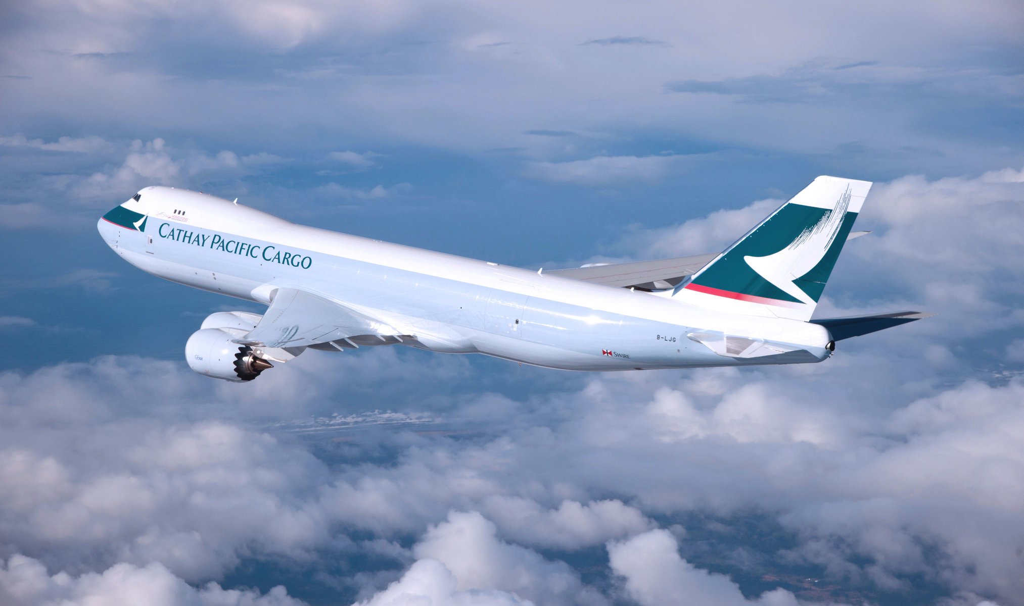 cathay pacific boeing samolot skrzydła lotnictwo chmury leci w powietrzu