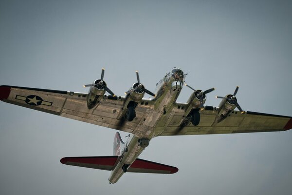 Military aircraft in the sky view from below