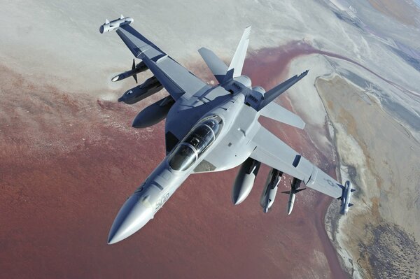 Avion militaire américain Boeing sur fond de surface terrestre