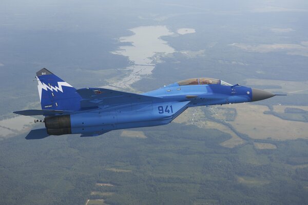 MiG-29 fighter in the sky over the river