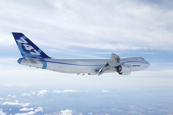 Boeing plane in the sky with clouds