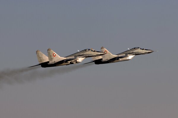 Two Mig 29 fighters the sky is gray