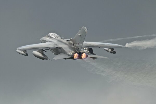 A plane with a tornado gr4 weapon in the sky