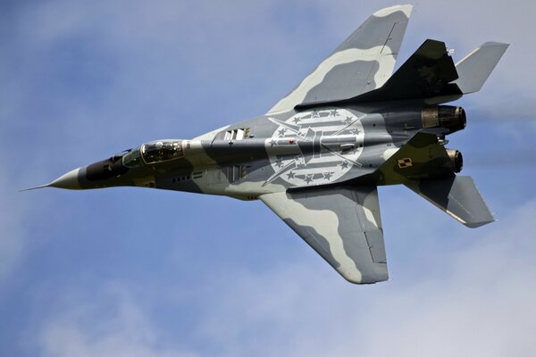 A military plane is racing against the sky