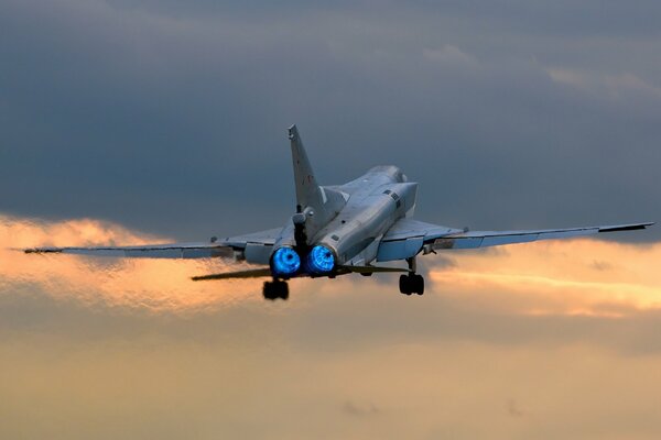 Bomber takes off against the background of sunset