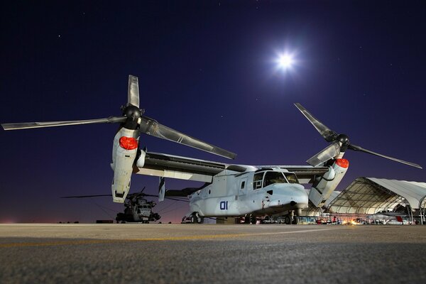 A moonlit night and a plane at the airfield