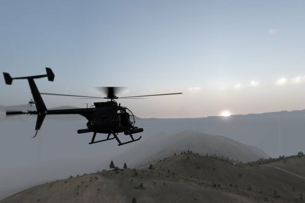 Полет вертолёта над горами на закате