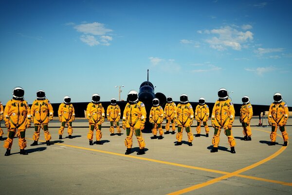 Airplane pilots in identical yellow suits