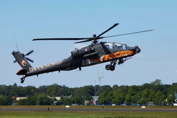 A combat helicopter taking off into the sky