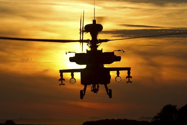 Apache ah1 helicopter at sunset