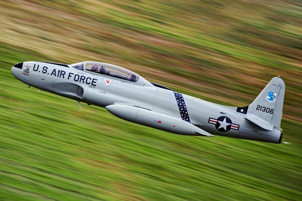 Lockheed T-33 Shooting Star Flies Low Over the Surface