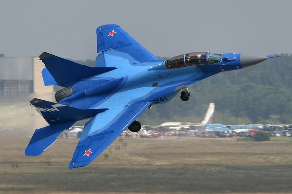Blue mig plane takes off into the sky