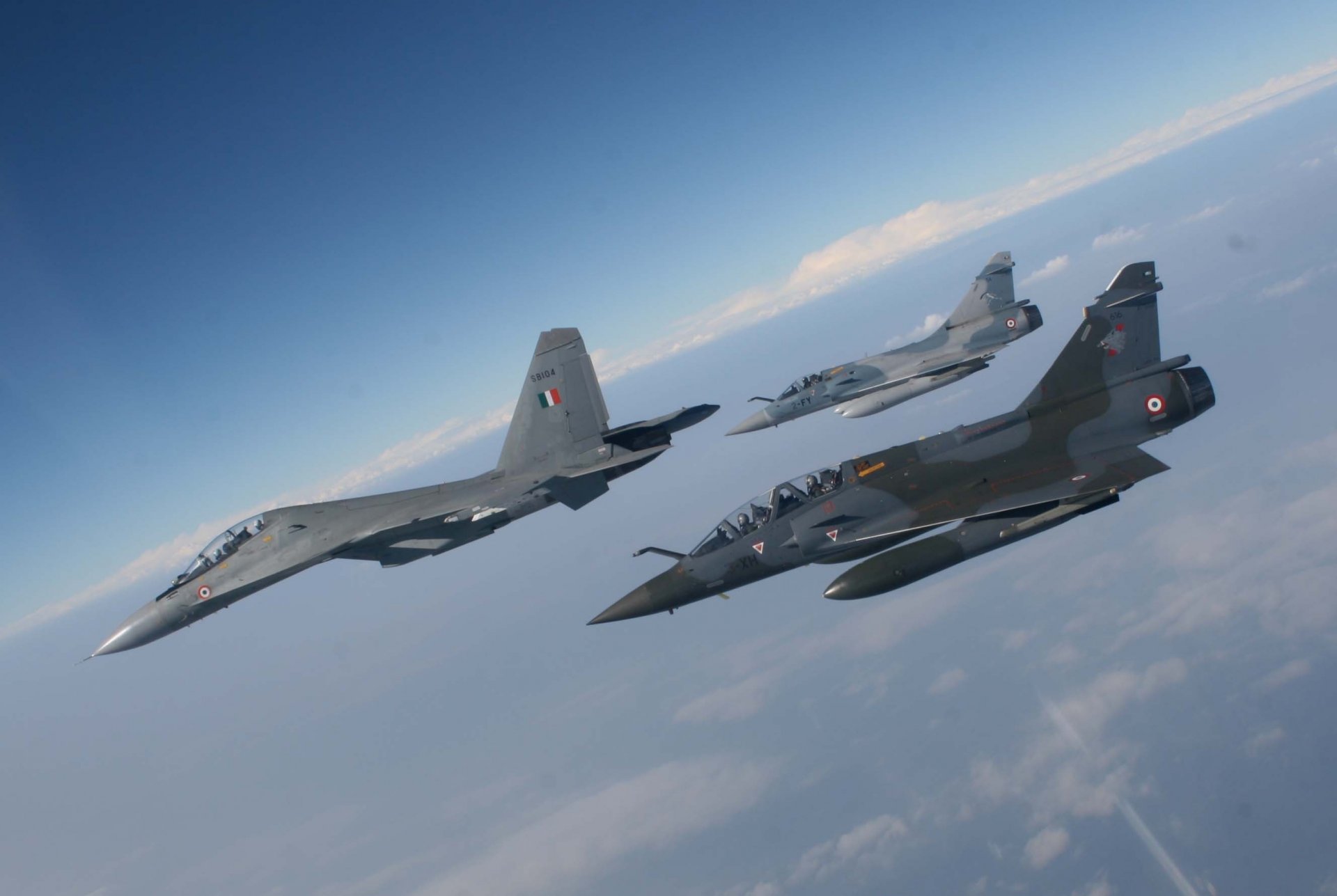 air force france sukhoi su-30 multi-purpose fighter dassault mirage 2000 dassault french flight sky clouds altitude photo