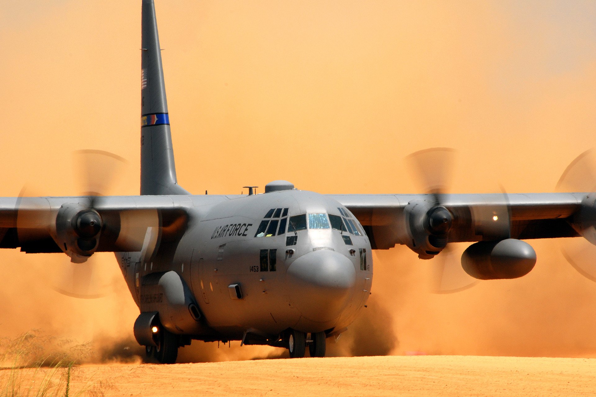 lockheed c-130 hercules plane planting dust