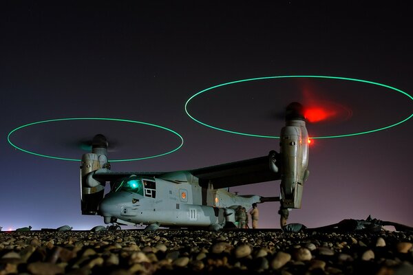 The plane demonstrates its turntables against the background of the night sky