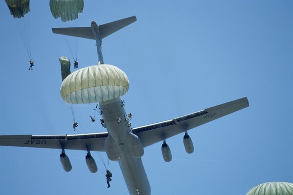 Paratroopers perform a jump from a military aircraft