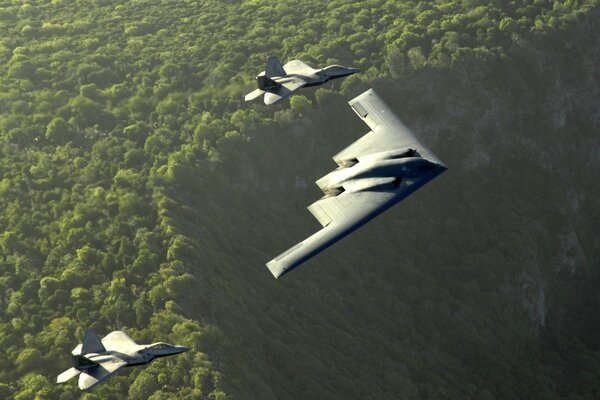 B-2 stealth fighters fly over the woodlands