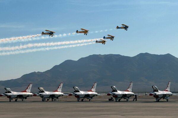 Five planes in flight, five not on the background of mountains