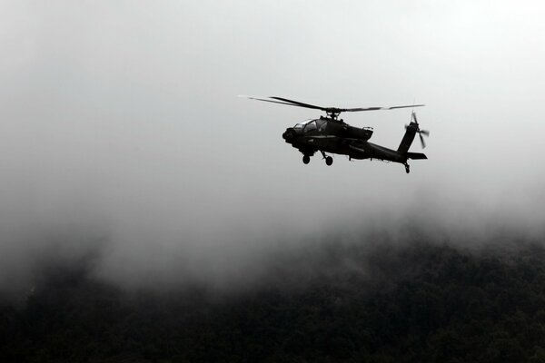 Black and white photo of a helicopter on a blurry background