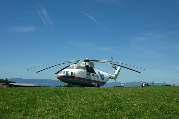 Russian Mi-26 aircraft on a meadow in the mountains