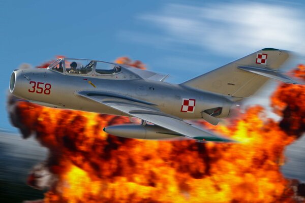 MIG 18 fighter jet in the sky on fire