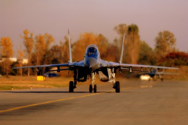 A fighter plane takes off from the airfield