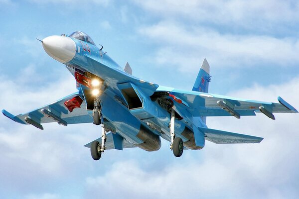 The Su-27 fighter is well camouflaged in the sky