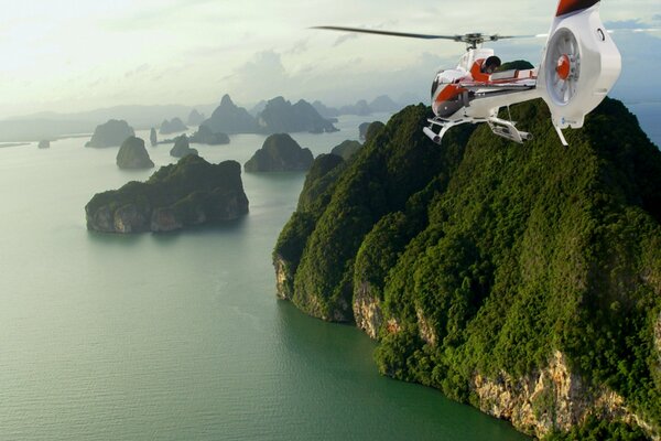 Helicopter flying around the expanses of Thailand