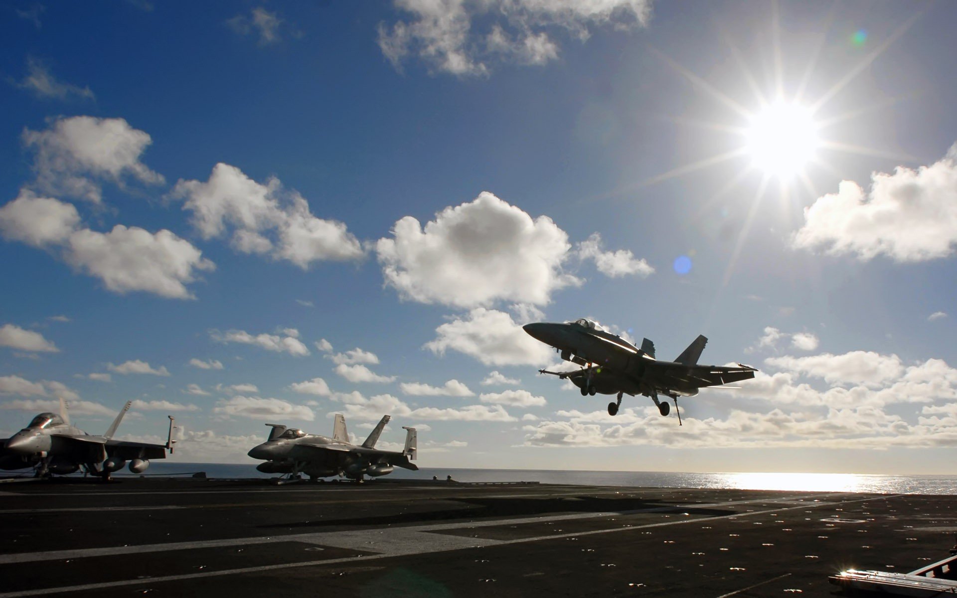 the carrier planting fighter clouds sun