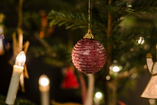 Christmas tree toy surrounded by candles