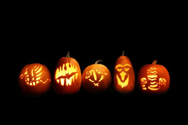 Glowing Halloween pumpkins with different patterns