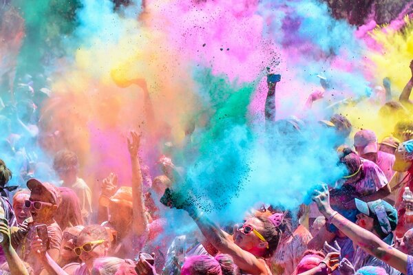 Multicolored coloring powder over the crowd