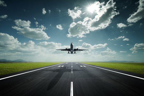 A plane taking off leaves a shadow on the highway