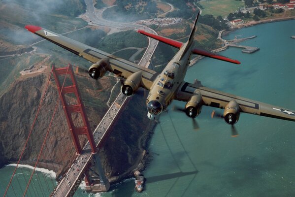 A flying plane over the Golden Gate