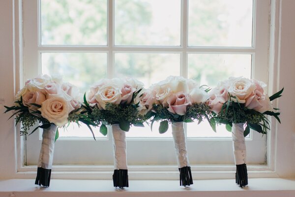 Four wedding bouquets of roses