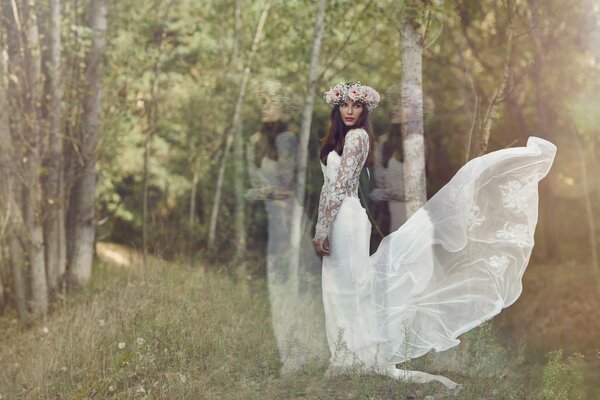 The bride in a wreath on the background of nature