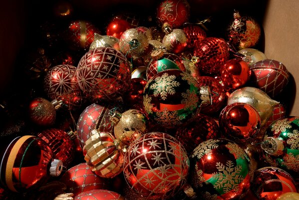 Red Christmas decorations in a pile