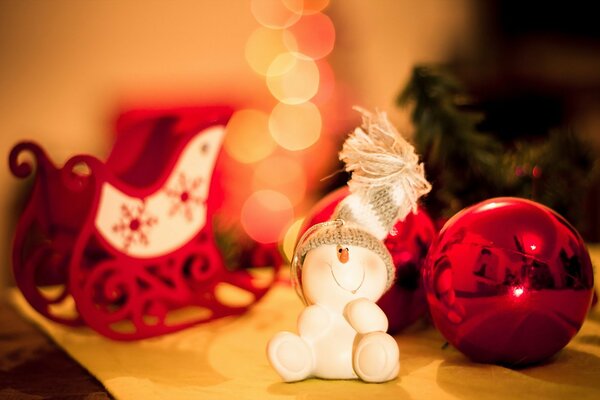 New Year s snowman on the Christmas tree in a hat