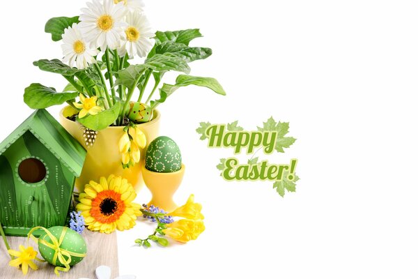 The feast of Holy Easter, eggs and festive gerberas on the table