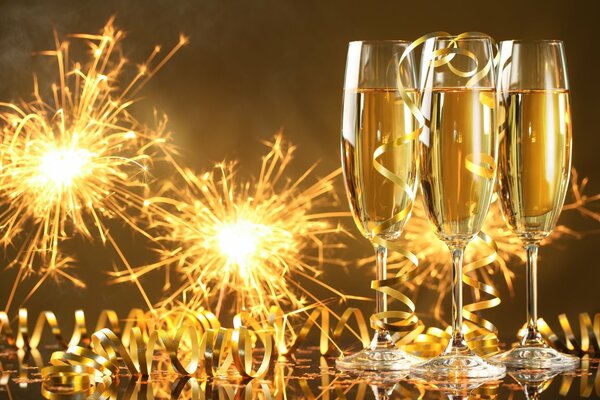 Champagne glasses on the background of sparklers