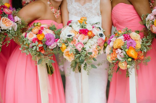 Bridesmaids with flowers in their hands